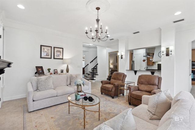 living room featuring ornamental molding and a notable chandelier