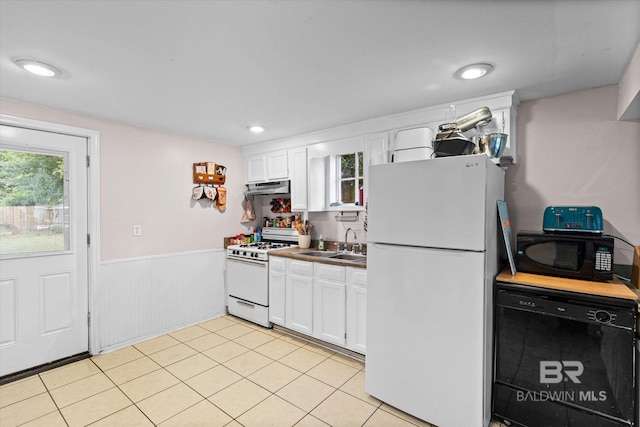 162 Westwood St, Mobile, AL 36606 - kitchen with white appliances, a sink, under cabinet range hood, a wainscoted wall, and white cabinets