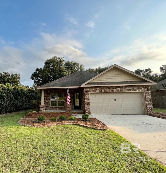 view of front facade featuring a front lawn and a garage