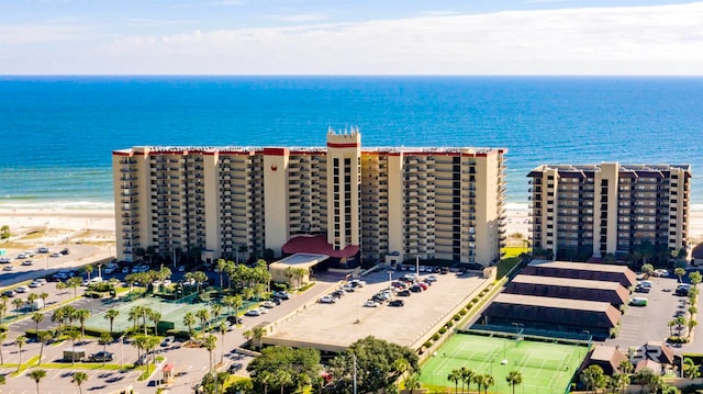 birds eye view of property with a beach view and a water view