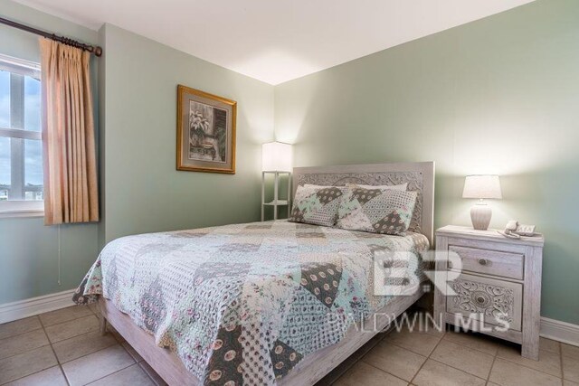 bedroom with tile floors