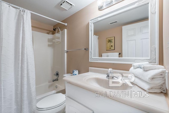 full bathroom with vanity with extensive cabinet space, toilet, and shower / tub combo