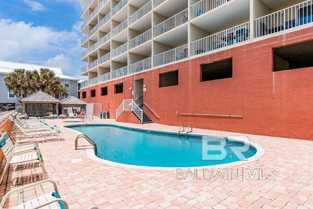 view of pool featuring a patio area and a gazebo