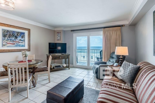 tiled living room with a water view and crown molding