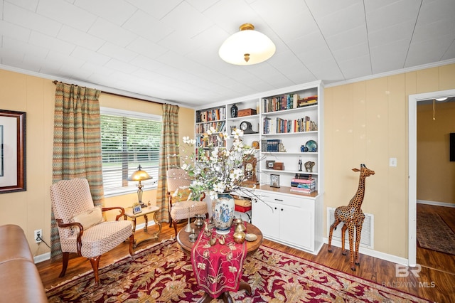 56 Old Bratt Rd, Atmore, AL 36502 - sitting room featuring wood finished floors, ornamental molding, and baseboards