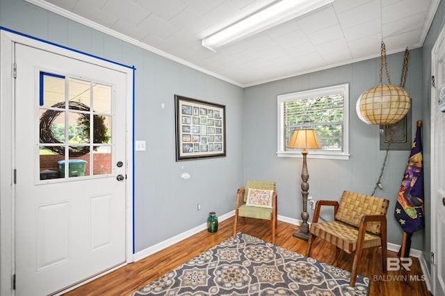 56 Old Bratt Rd, Atmore, AL 36502 - entryway featuring crown molding, wood finished floors, and baseboards