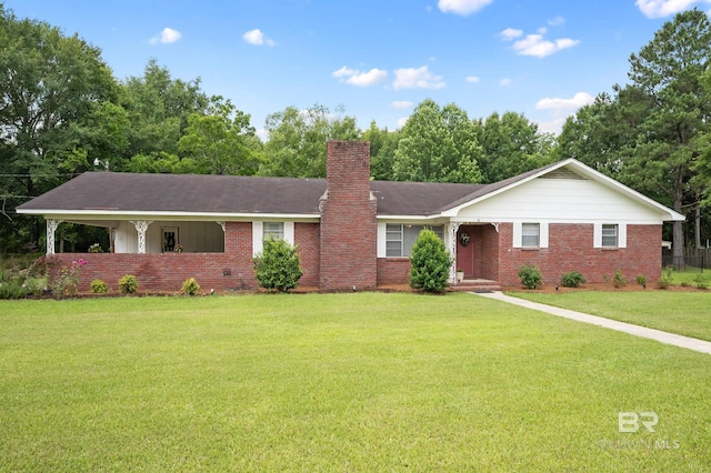 56 Old Bratt Rd, Atmore, AL 36502 - ranch-style house with brick siding, a chimney, and a front yard