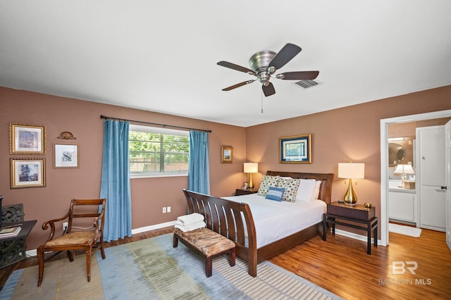 56 Old Bratt Rd, Atmore, AL 36502 - bedroom featuring wood finished floors, baseboards, and ceiling fan