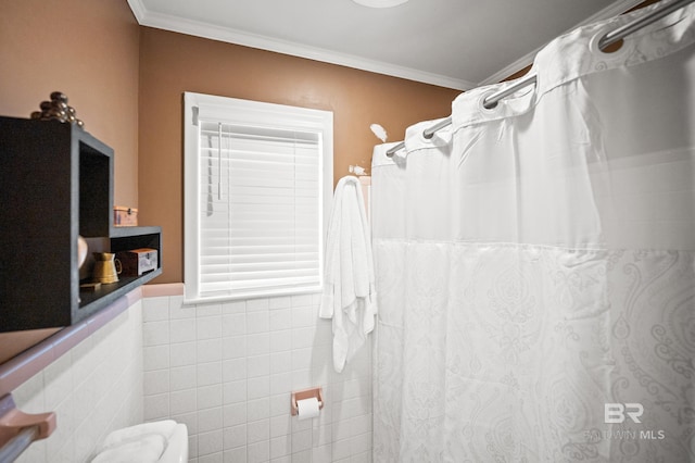 56 Old Bratt Rd, Atmore, AL 36502 - full bath with ornamental molding, tile walls, a wainscoted wall, toilet, and curtained shower