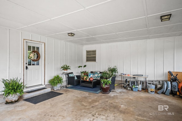 56 Old Bratt Rd, Atmore, AL 36502 - view of exterior entry with outdoor lounge area and board and batten siding
