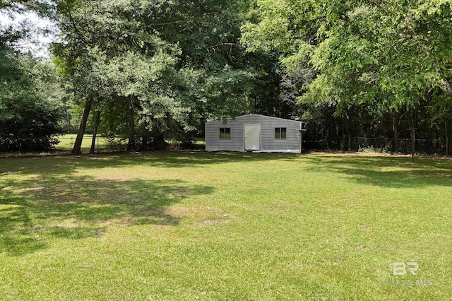 56 Old Bratt Rd, Atmore, AL 36502 - view of yard with an outdoor structure