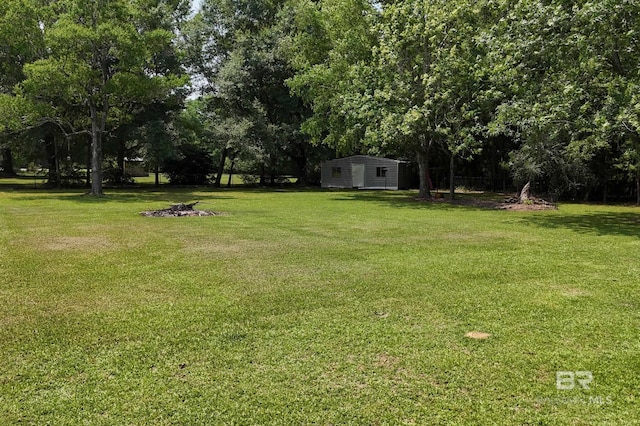 56 Old Bratt Rd, Atmore, AL 36502 - view of green lawn featuring view of scattered trees