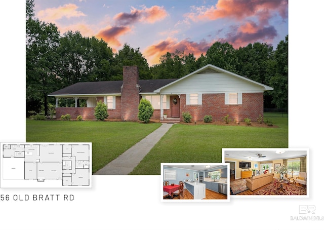 56 Old Bratt Rd, Atmore, AL 36502 - view of front of house featuring brick siding, a yard, and a chimney