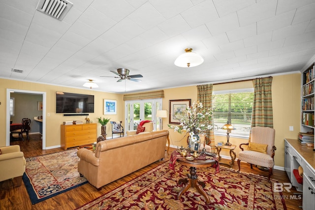 56 Old Bratt Rd, Atmore, AL 36502 - living room featuring wood finished floors, crown molding, baseboards, and a ceiling fan
