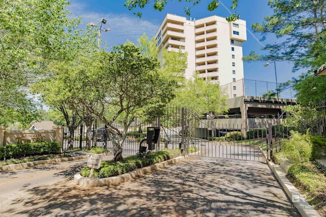surrounding community with fence and a gate