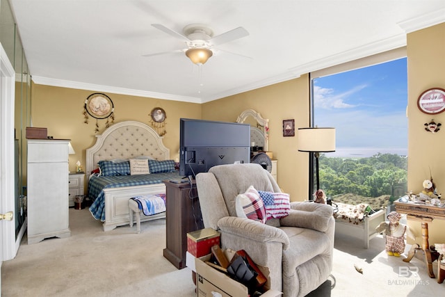 bedroom with crown molding, a ceiling fan, and light colored carpet