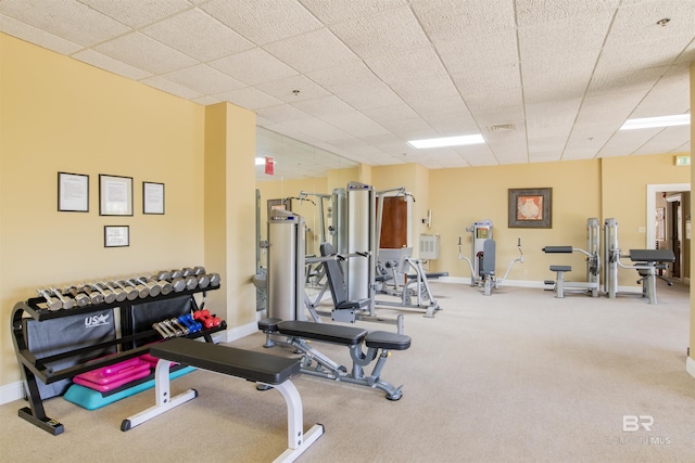 exercise room featuring baseboards, carpet flooring, and visible vents