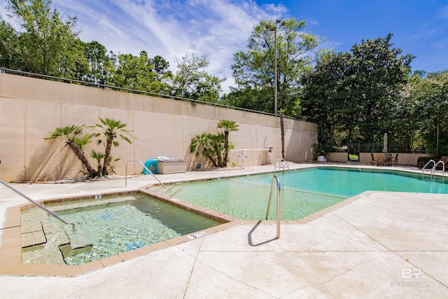 view of swimming pool with a fenced in pool, a fenced backyard, and a patio area