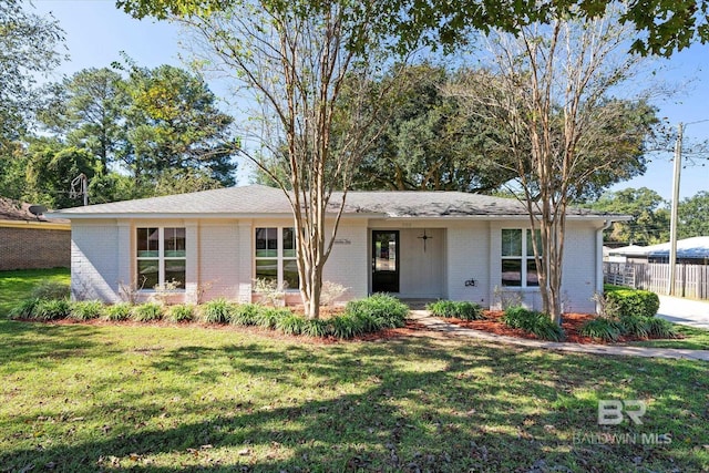 single story home with a front lawn