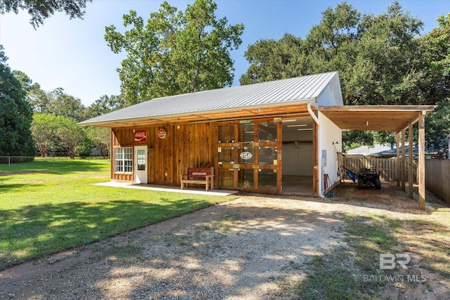 view of outbuilding with a lawn