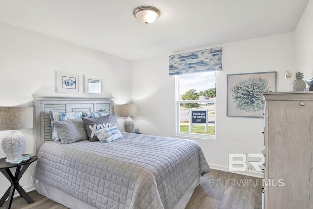 bedroom with hardwood / wood-style floors