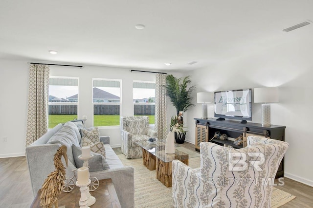 living room with light hardwood / wood-style floors