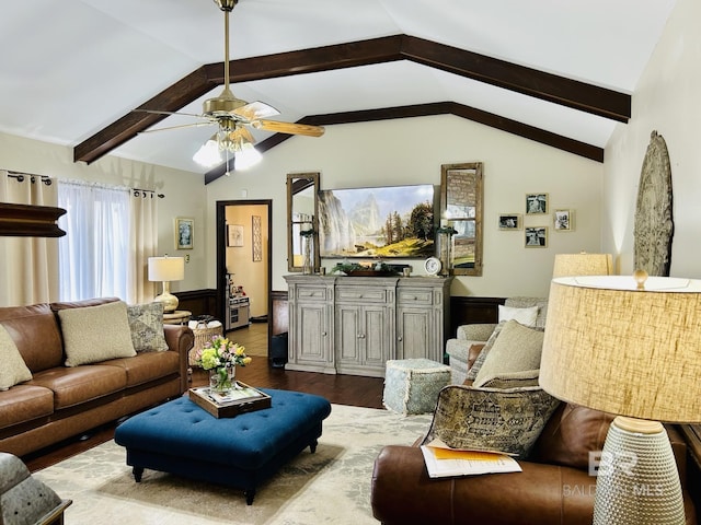 living room with vaulted ceiling with beams, ceiling fan, and dark wood-type flooring