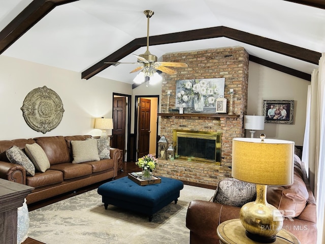 living area featuring vaulted ceiling with beams, a fireplace, and a ceiling fan