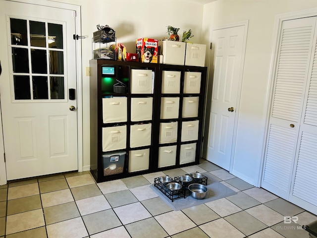 doorway featuring light tile patterned floors