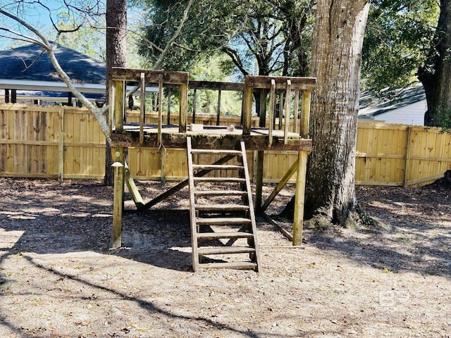 view of jungle gym with fence