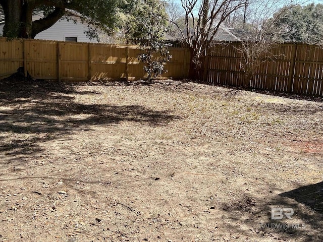 view of yard with a fenced backyard