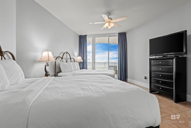 tiled bedroom featuring access to exterior and ceiling fan