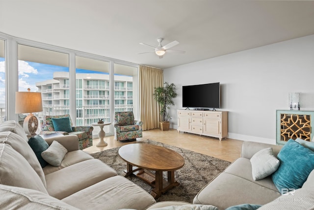 living room with ceiling fan and light tile patterned flooring