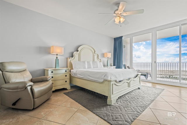 bedroom with ceiling fan, light tile patterned flooring, and access to outside