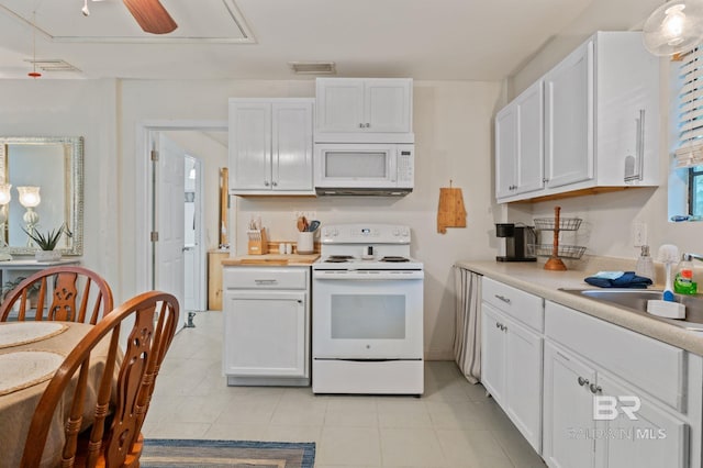 kitchen featuring light tile patterned flooring, white cabinets, white appliances, and ceiling fan