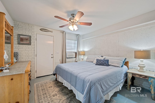 bedroom with cooling unit, light tile patterned flooring, and a ceiling fan