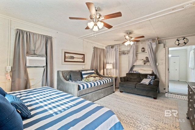 bedroom with ceiling fan, crown molding, cooling unit, and a textured ceiling