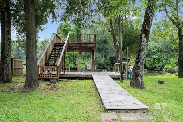 view of community featuring a lawn and a deck