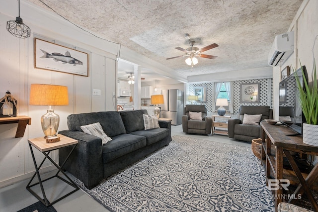 living room with ceiling fan, a textured ceiling, and a wall mounted AC