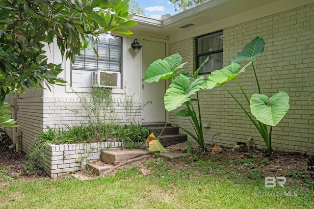 view of side of property featuring brick siding