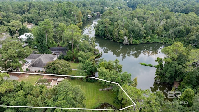 aerial view with a forest view and a water view