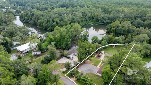 aerial view featuring a view of trees and a water view