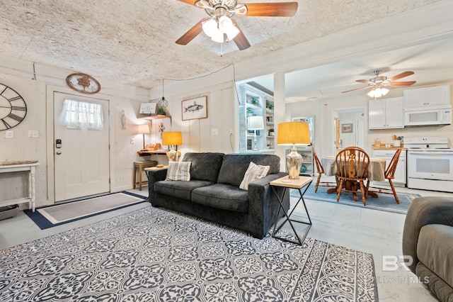 living room with ceiling fan