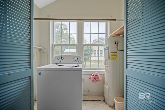 laundry room with electric water heater, a healthy amount of sunlight, and washer / dryer