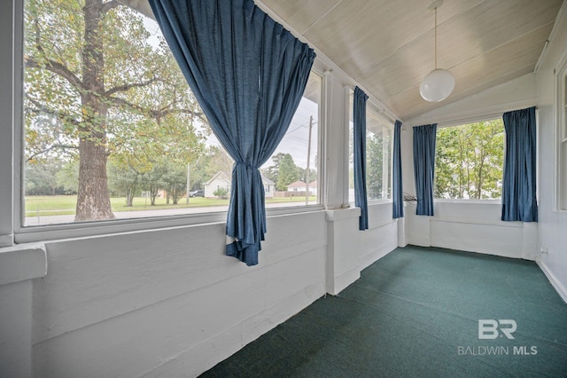 unfurnished sunroom with lofted ceiling and plenty of natural light