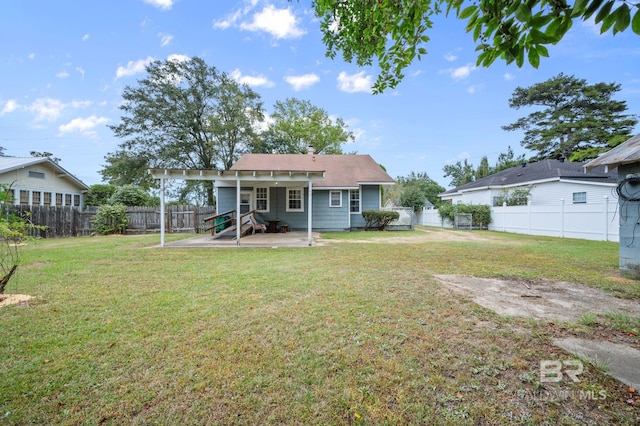 back of property featuring a patio and a lawn