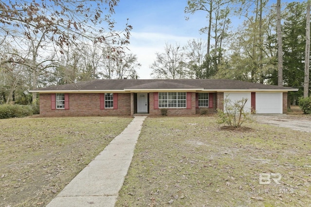 single story home featuring a front yard and a garage