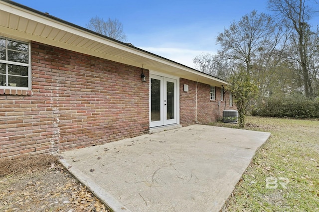 view of patio / terrace with central AC unit and french doors