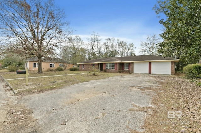 ranch-style house featuring a garage