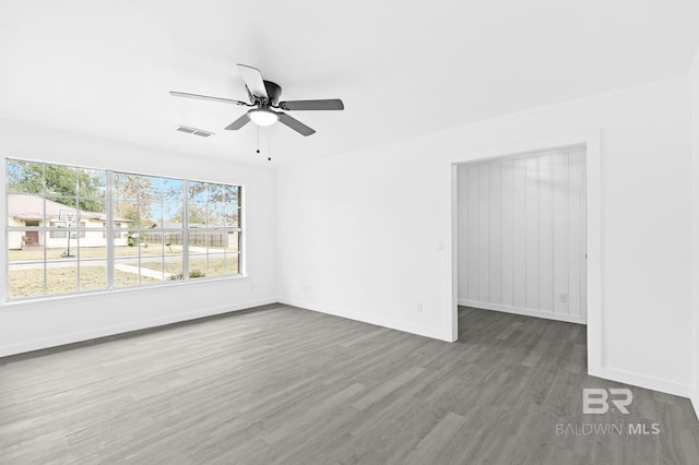 empty room featuring ceiling fan and wood-type flooring